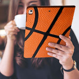 a girl is holding and viewing personalized iPad folio case with Sport design