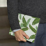 A business man holds Personalized VistaCase reMarkable Pen Holder Case with Green Leaves design