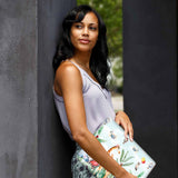 A yong girl holding personalized microsoft surface laptop case with Rainforest Animals design