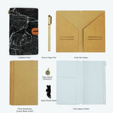 
the package contents of midori style traveler's notebook moody marble design with accessories 