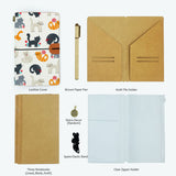 
the package contents of midori style traveler's notebook playful pussycats design with accessories 