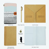 
the package contents of midori style traveler's notebook scandi spots and stripes design with accessories 