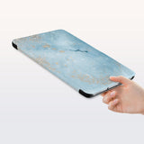 a hand is holding the Personalized Samsung Galaxy Tab Case with Marble Gold design