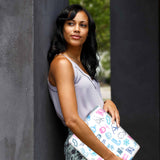 A yong girl holding personalized microsoft surface laptop case with Winter design