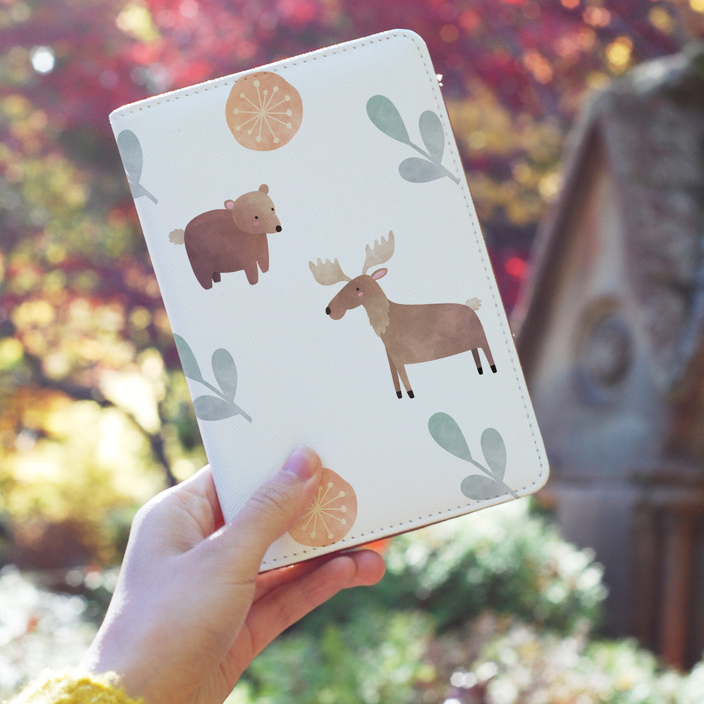 a girl holding personalized RFID blocking passport travel wallet with Woodland Animals design