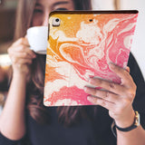 a girl is holding and viewing personalized iPad folio case with Abstract Oil Painting design 