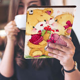 a girl is holding and viewing personalized iPad folio case with Bird design 