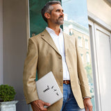 A business man carrying personalized microsoft surface case with Rock And Roll design in the park