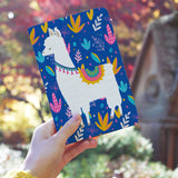 a girl holding personalized RFID blocking passport travel wallet with Llamas design